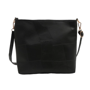 Large soft leather black shoulder bag with geometric patchwork and gold hardware for women