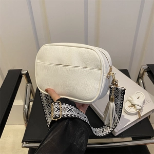 White litchi pattern camera bag with geometric wide strap and tassel decoration