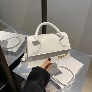 Minimalist white faux leather crossbody bag with gold hardware and top handle for women
