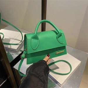 French style vibrant green leather crossbody bag with top handle and gold logo detail