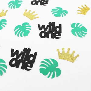 Wild One Hawaii 1st birthday party confetti with monstera leaves and glitter crowns
