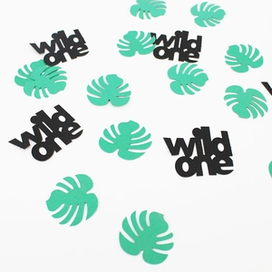 Detail of Wild One black lettering and green tropical palm leaf party confetti set