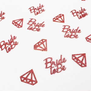 Pink glitter confetti with Bride to Be text and diamond shapes for bridal shower decor
