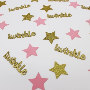 Macro detail of twinkle letters and gold glitter star confetti for baby shower decor