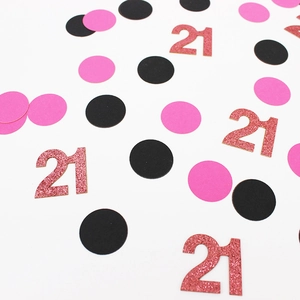 21st birthday confetti with pink glitter numbers and black dots for party table decor