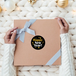 New Year party stickers featuring Happy New Year text on a gift box with festive decor