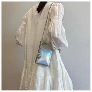 Holographic silver mini crossbody phone bag with woven strap and spherical knot detail