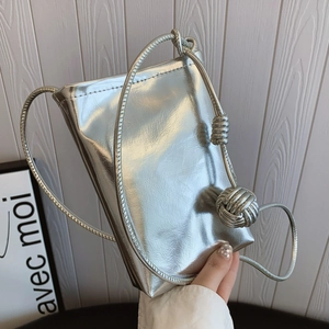 Metallic silver mini crossbody bag with rope strap and decorative woven knot detail