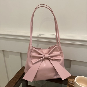 Pink PU leather bucket bag featuring a large bow detail and long handles for women