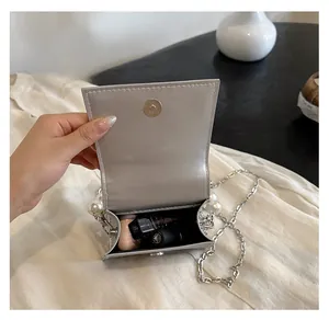 Silver mini square bag with pearl handle, metal chain and magnetic snap closure