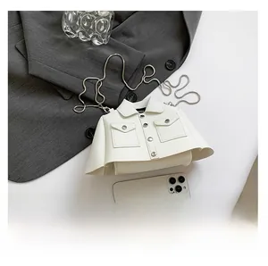 Creative white shirt-shaped leather crossbody bag with silver chain and smartphone for scale