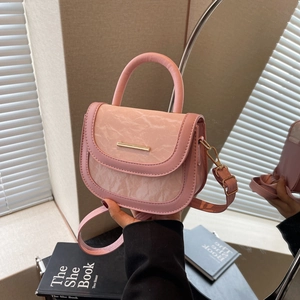 Chic pink half-moon saddle bag with marble pattern flap and golden metal clasp handle
