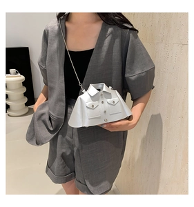 Detailed view of white creative shirt-shaped crossbody bag with silver chain and buttons