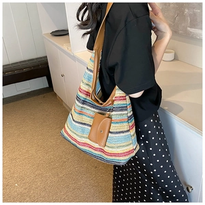 Rainbow woven tote bag with brown leather straps and small matching coin purse attachment