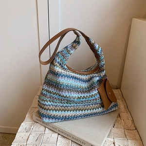 Rainbow woven straw tote bag with brown leather straps and a matching mini pouch