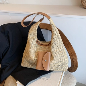 Summer straw hobo tote bag with leather straps and mini pouch on black blazer