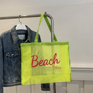 Neon green mesh beach tote bag with red Beach Vibes text and comfortable carry handles