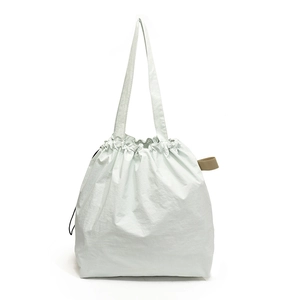 Large mint green drawstring tote bag with textured fabric for stylish daily commuting