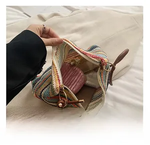 Detail view of large interior capacity of the colorful striped woven straw bag