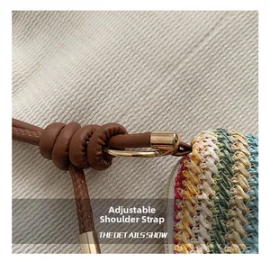 Detail of adjustable leather strap and rainbow straw weaving with golden hardware