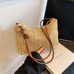 Rainbow striped woven tote bag with brown leather handles and decorative knots