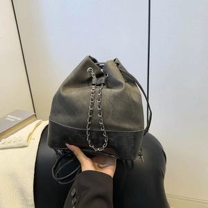 Chic grey canvas and black leather bucket bag with silver chain drawstring and handle