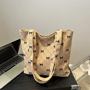 Beige corduroy tote bag with diamond pattern and small bow prints for daily use