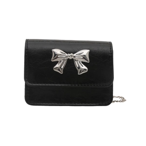 Mini black crossbody bag with bow detail and silver chain strap for women