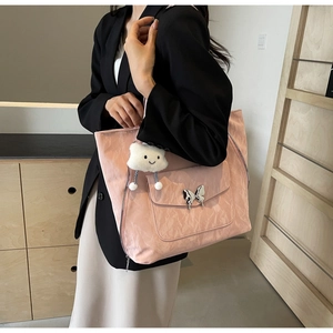 Pink pleated tote bag with silver butterfly buckle and plush cloud charm detail