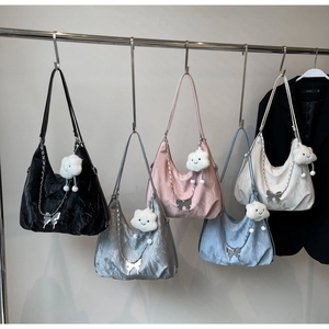 Five pleated tote bags in various colors hanging with silver chains and cloud charms