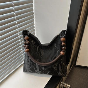 New Chinese style black pleated shoulder bag with retro wooden bead strap design
