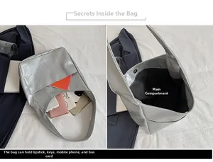 Detail showing the large capacity interior and woven texture of the silver tote bag