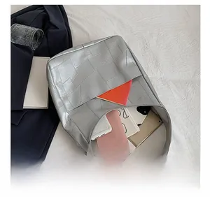 Top view of silver geometric tote bag interior showing ample storage space for daily items