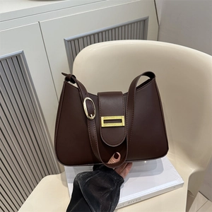 Dark brown underarm shoulder bag with golden buckle and curved minimalist design
