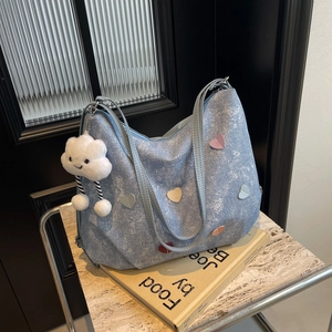 Light blue denim texture tote bag with colorful heart patches and cloud pendant accessory
