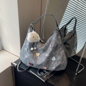 Metallic grey tote bag with colorful heart patches and cute cloud charm for daily commute