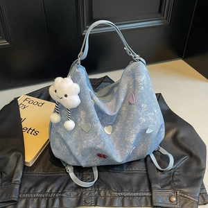 Denim heart tote bag in light blue with cloud plush charm and colorful embroidery