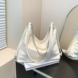 White faux leather tote bag with elegant silver chain and pearls decoration