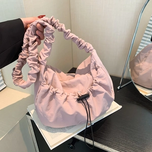 Chic pleated tote bag in dusty pink fabric with adjustable drawstring detail for women