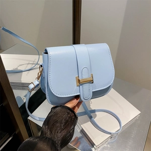 Light blue minimalist crossbody bag with gold H buckle and adjustable shoulder strap