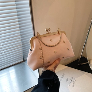 Chic pink top handle bag with gold heart studs and metal chain strap for women