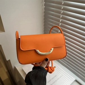 Chic orange matte leather crossbody bag with gold half-moon buckle and knotted strap