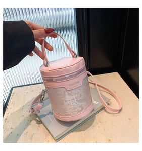 Pink cylinder bucket bag with Chinese style embroidery and detachable shoulder strap