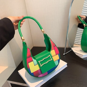 Green crescent shoulder bag with colorful geometric patchwork and gold metal buckle