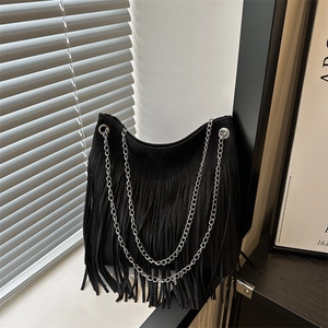 Vintage black suede hobo bag with tassel fringe and silver chain shoulder straps