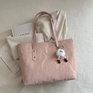 Pink crinkled faux leather tote bag with plush charm and dual shoulder straps