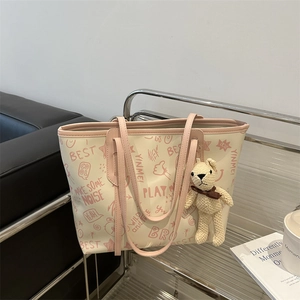Minimalist large capacity tote bag with pink trim and cute bear charm for women