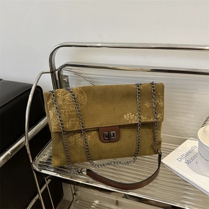 Olive green corduroy tote bag with floral embossing and metal chain strap for women