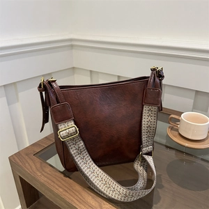 Large retro coffee tote bag with wide geometric pattern shoulder strap and leather texture