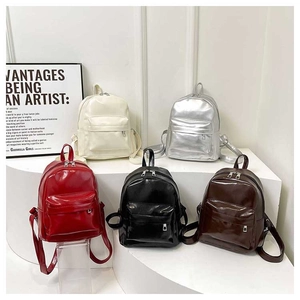 Detailed display of five stylish PU leather backpacks in various vibrant colors